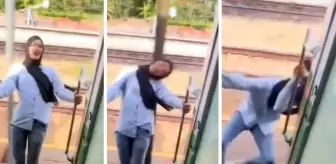 Fotoğraf çektirme merakı trenden sarkarak poz veren genç kızı az