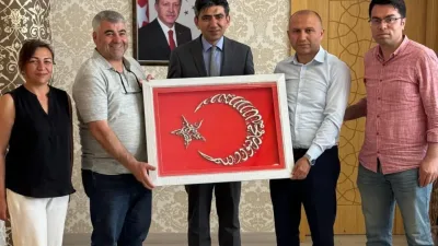 Yerköy Halk Eğitimi Merkezi yöneticileri, tayini çıkan Kaymakam Muharrem Coşgun’a